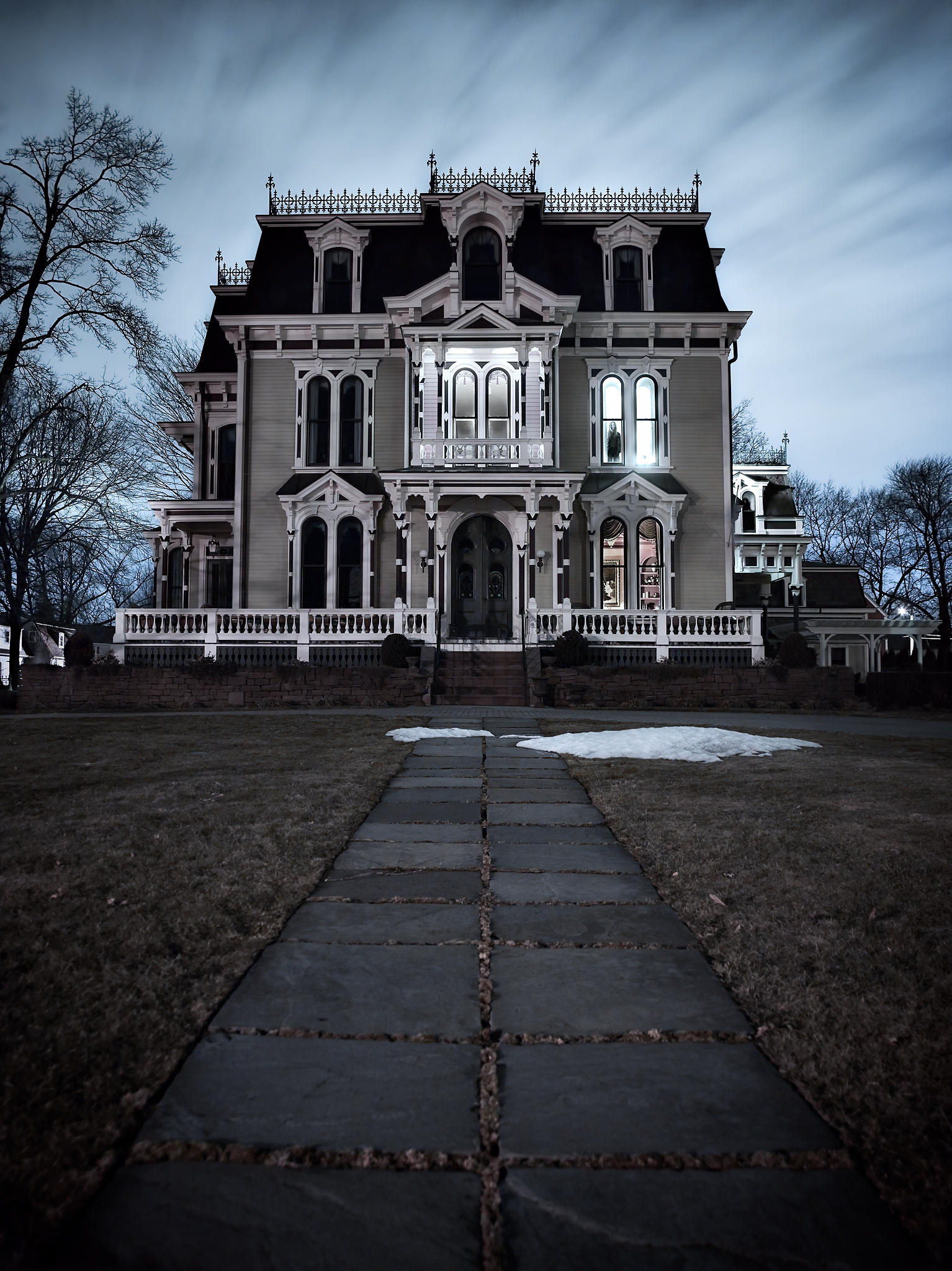 A figure stands in the second story window of the Silas W. Robbins House in Westersfield, Connecticut. In 1996 fire consumed much of the roof and interior. It remained abandoned untill it was purchased in 2001 by new owners. The next six years were spenr by Peter Adams.