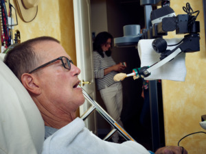 Henry Feeding Himself. Stretch RE1, caregiver, disability, reportage, science and technology, Hello Robot, Robots for Humanity, Henry Evans, research, robot, robotics.
