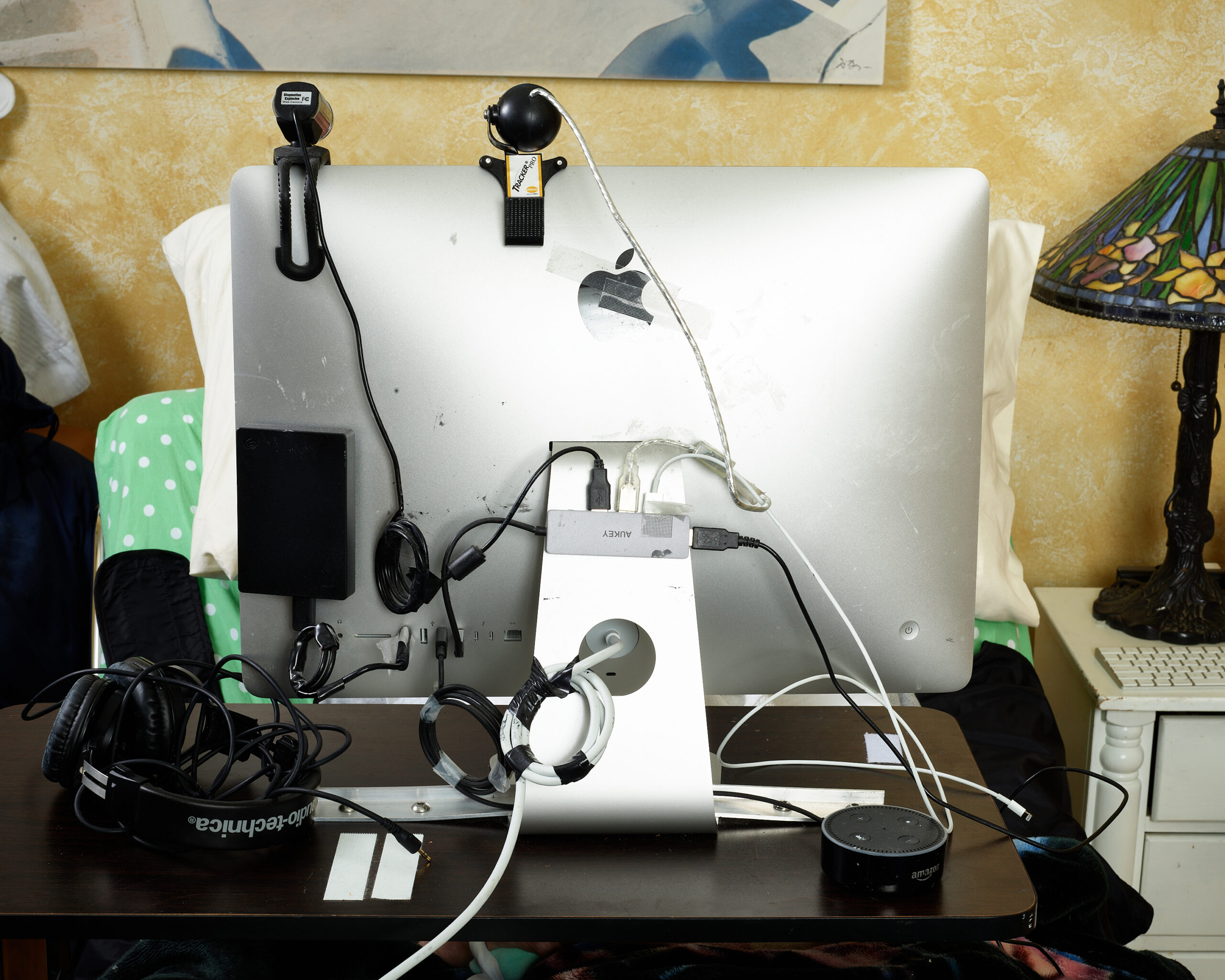 Henry's Computer. Stretch RE1, caregiver, disability, research, robot, robotics, computer, head tracking device, computer cords, computer wiring.